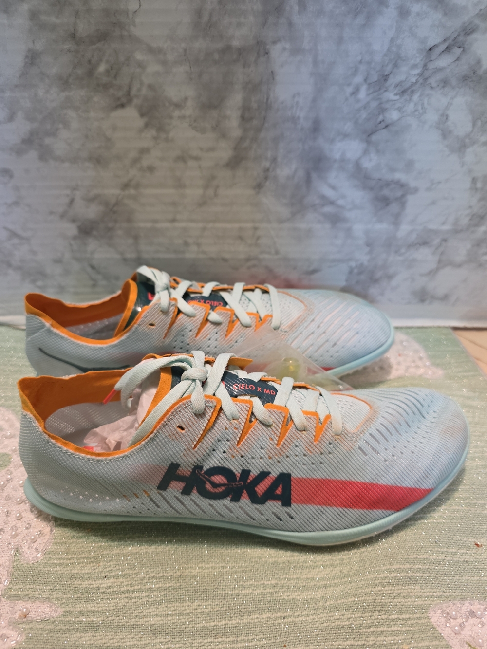 HOKA Lightweight Running Shoes in Light Blue with Orange Trim